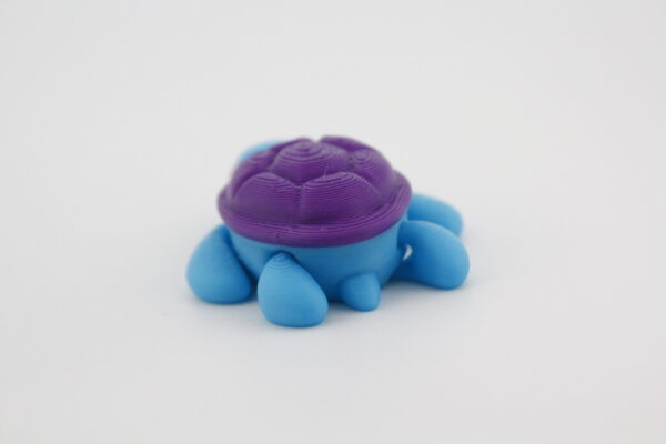 Turtle fidget toy - multiple colours making it either a sea turtle or land turtle - both have moving legs - Image 4